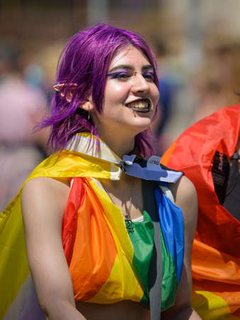 Vienna, Austria - June 11, 2022: People at Vienna Pride on Wiener Ringstrasse, girls with flagのeditorial素材