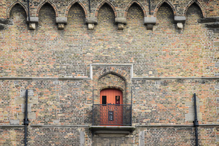 Brugge, Belgium - July 4, 2022: Small red door in the Belfry of Brugesのeditorial素材