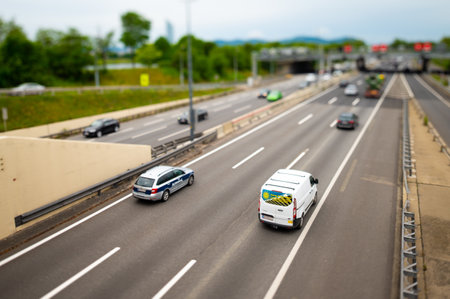 Vienna, Austria - June 5, 2020: Traffic on the A22 motorway in Vienna on a sunny day in spring. This is one of Vienna's most important transit routes along the river Danube.のeditorial素材