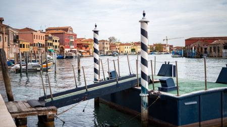 Venice, Italy - October 28, 2021: Canal in Murano on a cloudy day in autumn