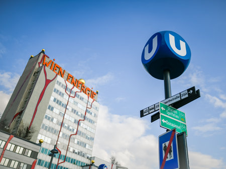 Vienna, Austria - February 28, 2022: Sign of underground in front of building of Wien Energie on a sunny day in winterのeditorial素材