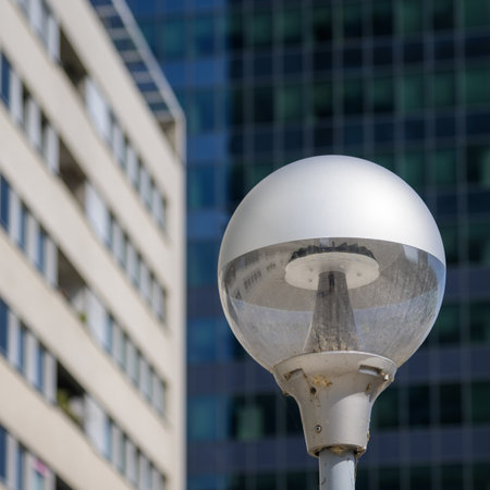 Vienna, Austria - September 8, 2022: Street lamp in front of modern buildingsの写真素材
