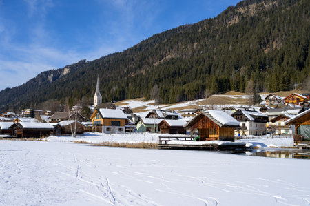 Weissensee, Austria - February 8, 2022: Lake Weissensee (Austria) on a cold sunny day in winterのeditorial素材