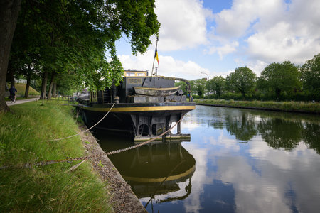 Bruges, Belgium - July 3, 2022: An old ship on a river in bruges, summer, daylightのeditorial素材