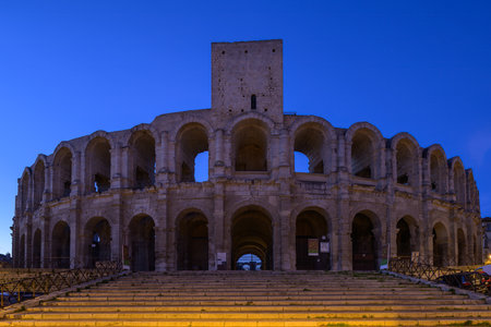 Arles, France - March 13, 2023: The roman Arena of Arles early in the morning, blue hour