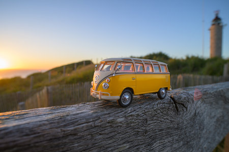 Cap de gris nez, France - July 7, 2022: A 9 seater minibus on a piece of wood near the sea, sunset,...