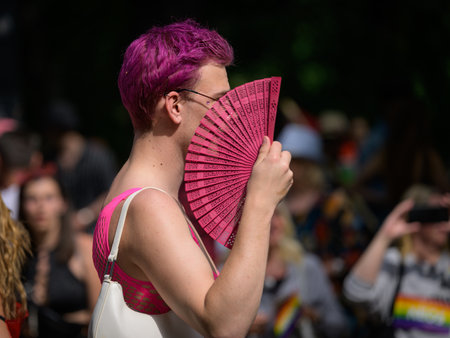 Vienna, Austria - June 17, 2023: People at Vienna Pride in summer on Wiener Ringstrasse, man with pink hairのeditorial素材