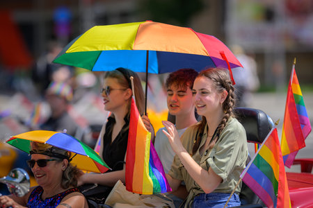 Vienna, Austria - June 08, 2024: People at Vienna Pride in summer on Wiener Ringstrasse, young...