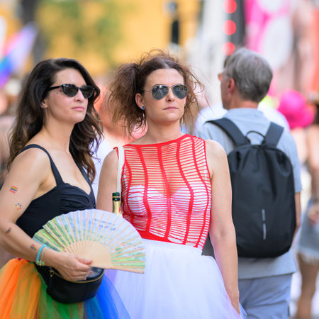 Vienna, Austria - June 08, 2024: People at Vienna Pride in summer on Wiener Ringstrasse, woman walking on the streetのeditorial素材