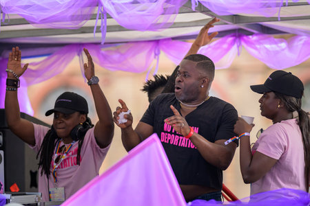 Vienna, Austria - June 08, 2024: People at Vienna Pride in summer on Wiener Ringstrasse, man dancing on a truckのeditorial素材