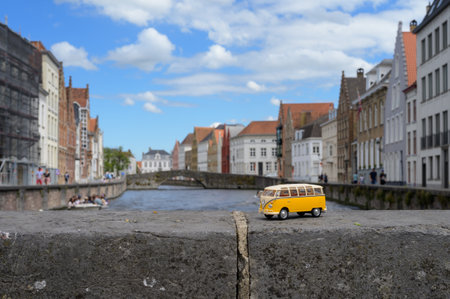 Bruges, Belgium - July 3, 2022: A toy VW bus parked in front of houses in the city of Brugesのeditorial素材