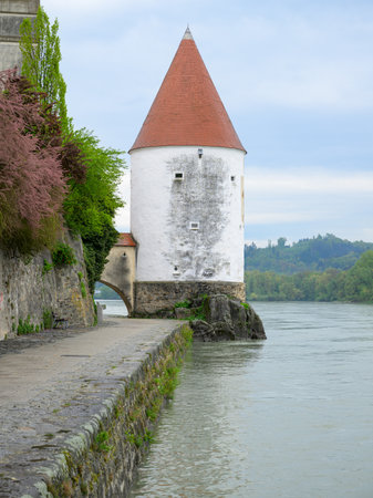 Passau, Germay - April 15, 2024: Schaibling Tower on a cloudy day in springtime, river Innのeditorial素材