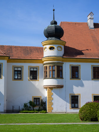 Reichersberg, Austria - April 12, 2024: Reichersberg Abbey on a sunny day in springtime, blue sky