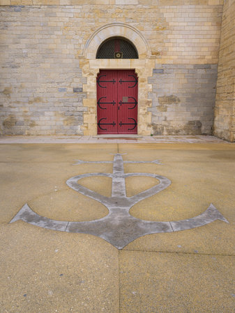 Saintes Maries de la Mer, France - March 9, 2023: The church of Saintes Maries de la Mer on a cloudy day in springtimeの写真素材