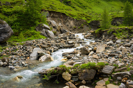 Krumlbach on a cloudy day in springtime, Salzburg (Austria)の写真素材