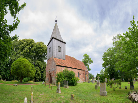 The small village church of Gross Zicker, Ruegen (Germany), cloudy day in summerの写真素材