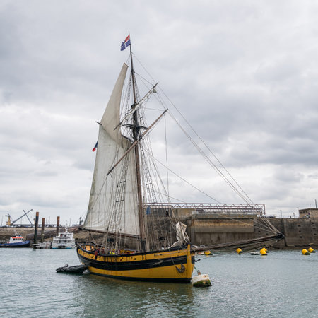 Saint-Malo, France - August 11, 2018: Old wooden sailing boat in harbor of Saint Malo on cloudy summer dayのeditorial素材