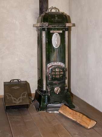 Niedersulz, Austria - May 27, 2018: An old wooden stove is displayed indoors at a museum exhibition showing historic household appliances.のeditorial素材