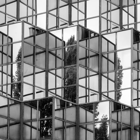 Vienna, Austria - October 11, 2025: Reflecting facade of a modern house in Vienna captured in autumn...