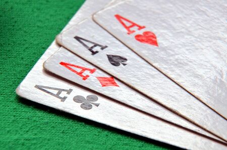 Aces cards detail on green tableの写真素材