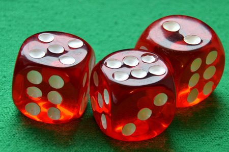Gamble dices on green table