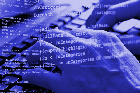 Close-up of typing male hands on computer keyboard with php code collage in blue color