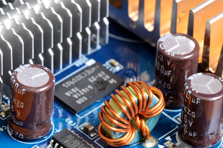Detail of graphics card - inductors, cooler, capacitors and chips