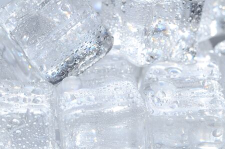 Macro detail of group of ice cubes with water droplets