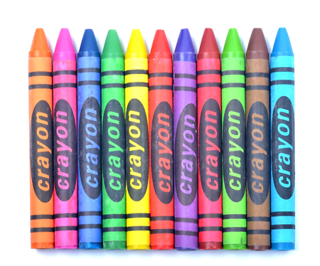 Colorful wax crayons of all colors - lined up isolated on white backgroundの写真素材