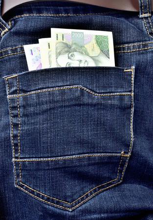 Back pocket of jeans full of czech banknotes, czech crowns - vertical photoの写真素材