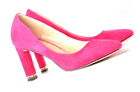 Ladies suede red shoes isolated on white backgroundの写真素材