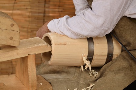 Craftsman make a medieval vats in his workshopの写真素材