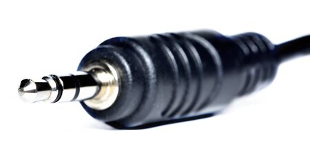 Close-up of 3.5mm jack connector isolated on white background.の写真素材