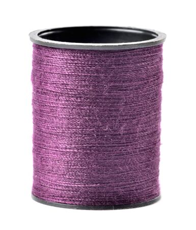 Purple thread spool isolated on white background