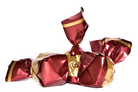 Chocolate candies wrapped in shiny ornamental wrappingの写真素材