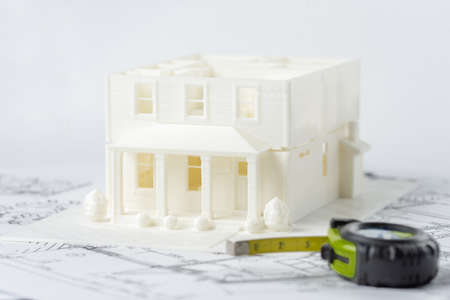 3D plastic model of the family house without roof printed on a 3D printer with white filament by FDM...