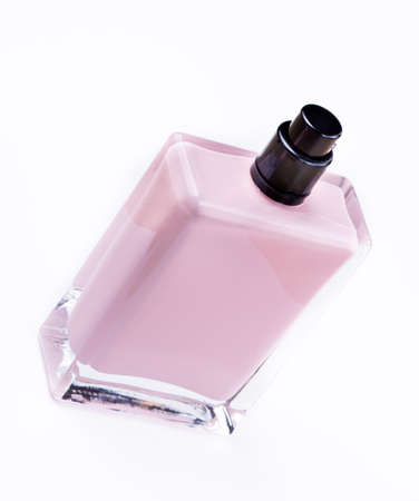Luxury opened womens fragrance in a glass bottle isolated on white backgroundの写真素材