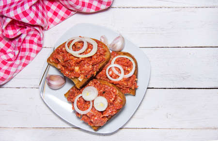View from above of Czech toasted breads with raw beef steak tartare and onions.の写真素材