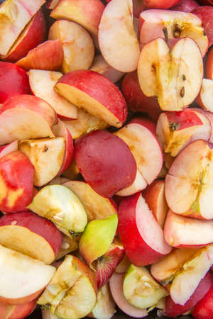Chopped fresh apples ready for the fermentation process to make alcoholの写真素材
