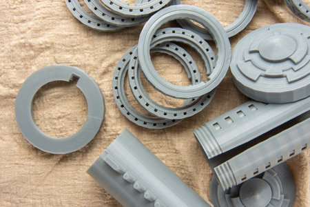 Top view of heap of plastic parts printed on a 3D printer.