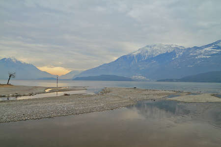Como lake, shores facing the sunsetの写真素材