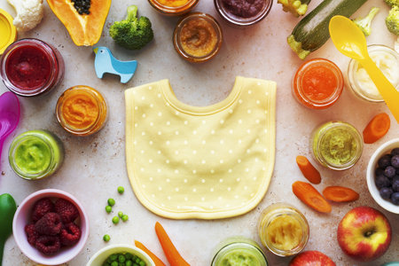 Baby bib newborn organic food ingredients in flat lay styleの写真素材