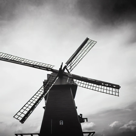 Black windmill against on sky in monochrome toneの素材