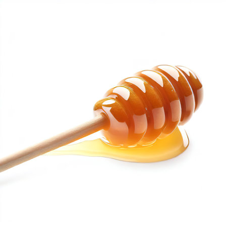honey stirrer isolated on white backgroundの素材