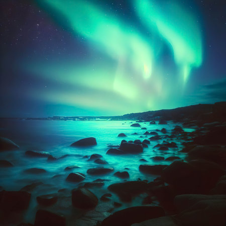 Aurora borealis over rocky beach and ocean. Northern lights in Teriberka, Russia.の素材