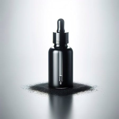 Black glass dropper serum bottle on white backgroundの素材