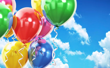 Multicolored balloons on a blue sky background. Concept of celebration, greeting banner, Birthday partyの素材