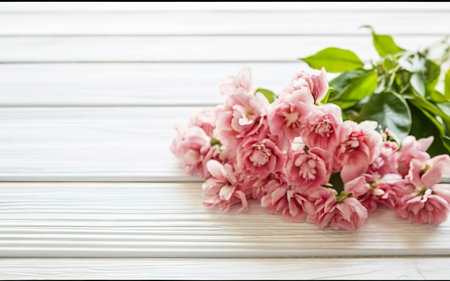 Pink flowers on white wooden background. Selective focusの素材
