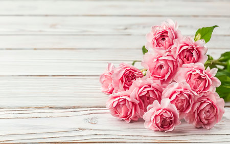 Pink flowers on white wooden background. Selective focusの素材