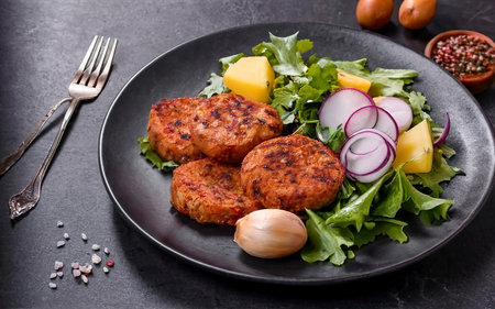 vegan lentil cutlets without meat with potatoes and salad. healthy eatingの素材